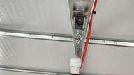 The flexible nature of the dual eye bolts allows the fan to do what it wants without danger of stressing anything.