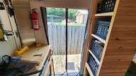 I modified a $14.00 magnetic screen from Home Depot to fit this door.  It's great, actually.