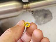 Looking down the barrel of a commerically available 12-10AWG butt splice.  It is covered with a plastic shell meant to provide electrical insulation, but we need water-tightness also. I'll be stripping the yellow off and providing a hot-glue lined heat shrink tube for insulation.
